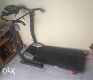Black And Gray Motorized Treadmill