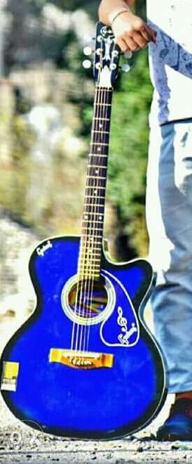 Blue acoustic guitar. very good condition.