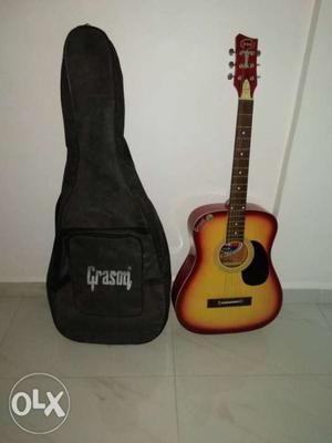 Brown, Red, And Black Grason Acoustic Guitar With Black Bag