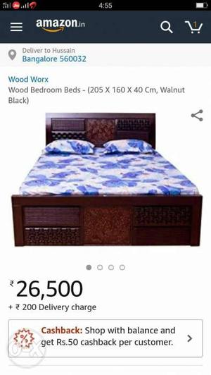 Brown Wooden Bed And Purple And White Mattress Screenshot