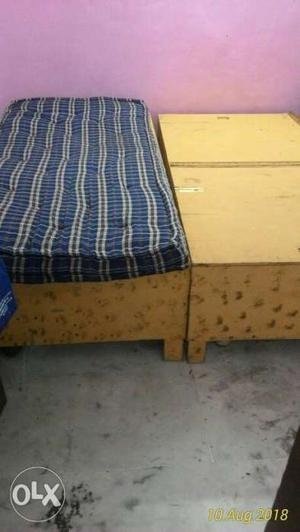 Brown Wooden Bed Frame With Blue And White Mattress