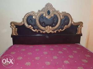 Brown Wooden Bed Frame With Pink Floral Mattress