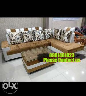 Brown Wooden Framed White Padded Sectional Couch