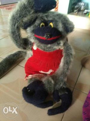Closeup Photo Of Red And Black Monkey Plush Toy