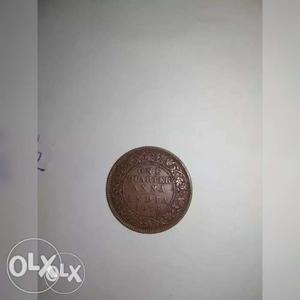 Copper-colored One Quarter India Anna Coin
