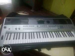 Gray And Black Roland Electric Keyboard