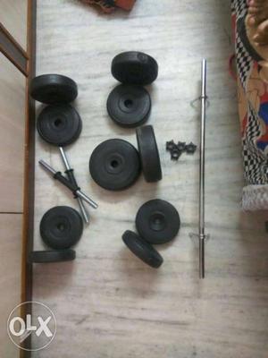 Gray Barbell Bar And Pair Of Adjustable Dumbbells