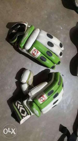 Pair Of Green-and-white Cricket Gloves