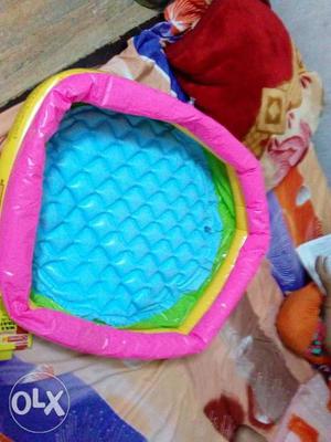 Pink, Green, And Yellow Inflatable Pool