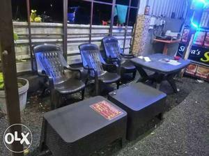 Several Black Windsor Plastic Armchairs And Two Rectangular