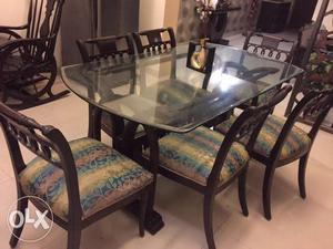 Teak wood dining table with 6 chairs in good condition for