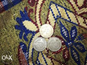 Three Round Silver-colored 25 Coins