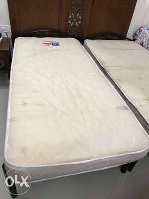 Two 3' X 6' wrought iron bed with mattresses