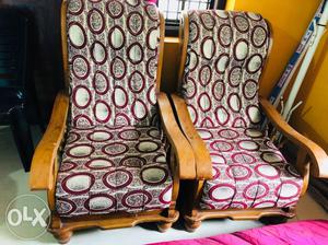 Two Brown Wooden Framed Purple Padded Armchairs