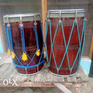 Two Round Brown Percussion Instruments
