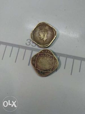 Two Silver-colored Indian Coins On White Board