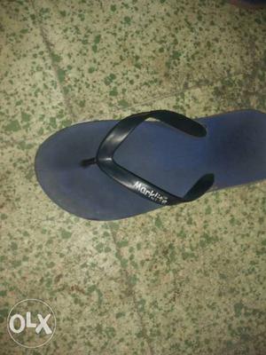 Unpaired Blue And Black Flip-flop