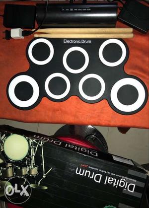 White And Black Electronic Drum With Drum Stick