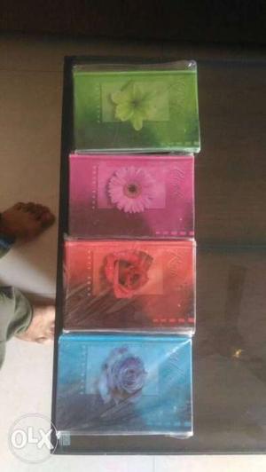 4 diaries of different colours in 100