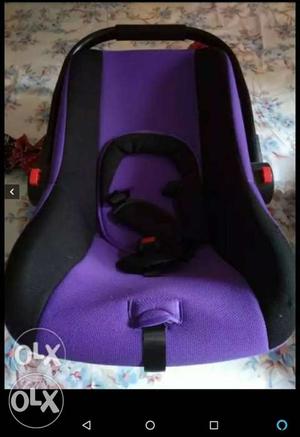 Baby's Purple And Black Seat Carrier