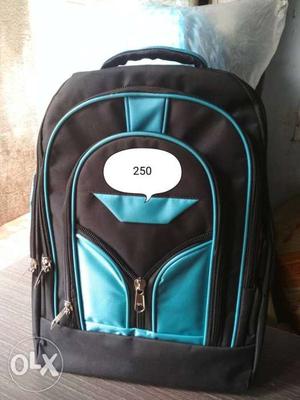 Blue And Black Backpack On Brown Cloth