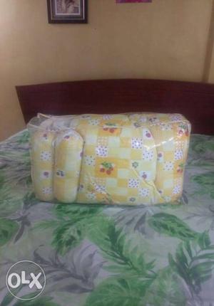 Brand new baby bed with a pillow and 2 roll