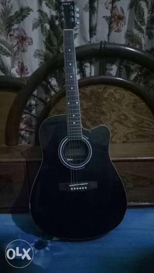 Its jimm acoustic guitar in very good condition