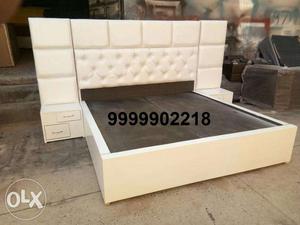 King size white bed with side table