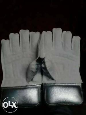 Pair Of White-and-silver Gloves