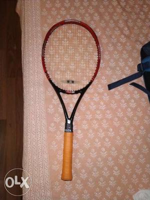 Red, Black, And Brown Tennis Racket