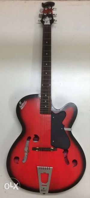 Red acoustic guiter which is great for