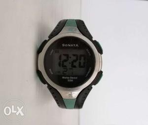 Round Silver Digital Watch With Black Strap