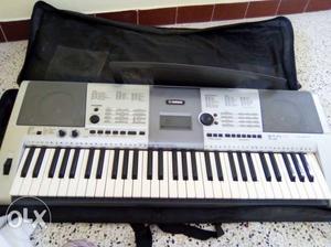 Silver Yamaha Electronic Keyboard