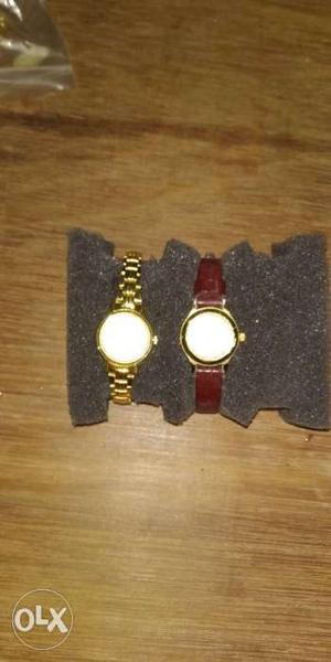 Two Round Gold-colored Bezel Watches
