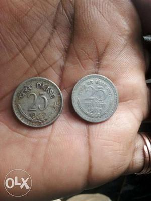 Two Round Silver-colored 25 Indian Paise Coins