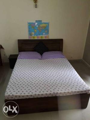 Brown Wooden Bed Frame With White Mattress. Inside box