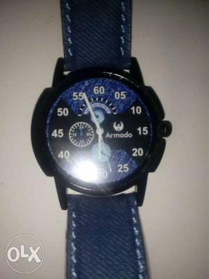 Round Black Chronograph Watch With Blue Straps