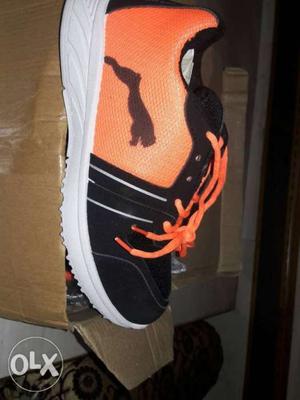 Unpaired Black And Orange Puma Running Shoe