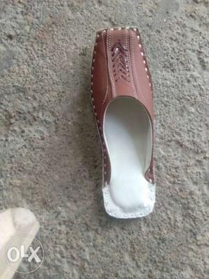 Unpaired Brown And White Leather Shoe