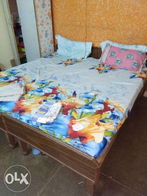 White, Blue, And Orange Floral Bed Sheets