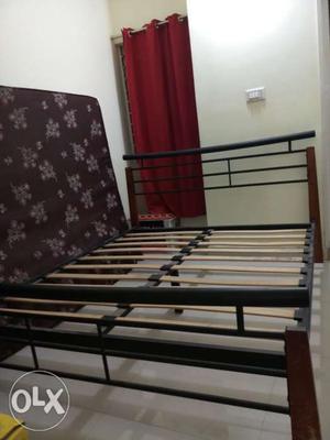 Wood and iron bed in a decent condition.