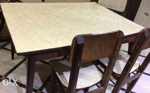 Wooden Dining Table. Only 3 chairs. (One chair