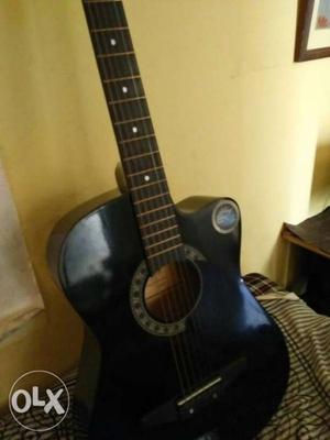 6 month used asouctic guitar with all Strings and