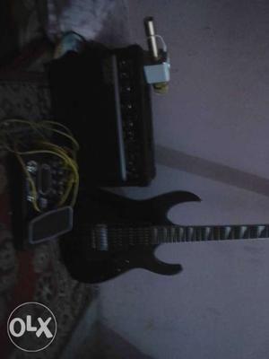 Black Electric Guitar With Amplifier