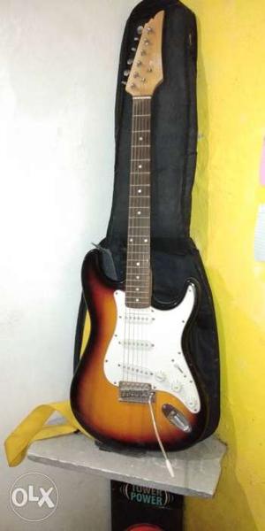 Brown And White Stratocaster-style Electric Guitar