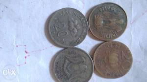 Four Round Silver-colored 20 Indian Paise Coins