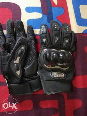 Pair Of Black Motorcycle Gloves