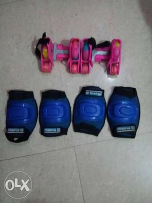 Pink color Street roller andFour Blue Knee Pads