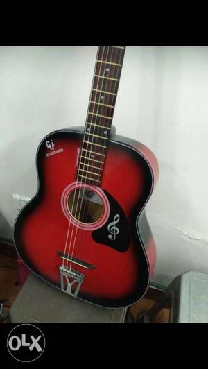 Red and black pure acoustic guitar 8..1,