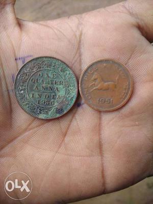 Two Round Copper-colored Indian Anna And Pice Coins